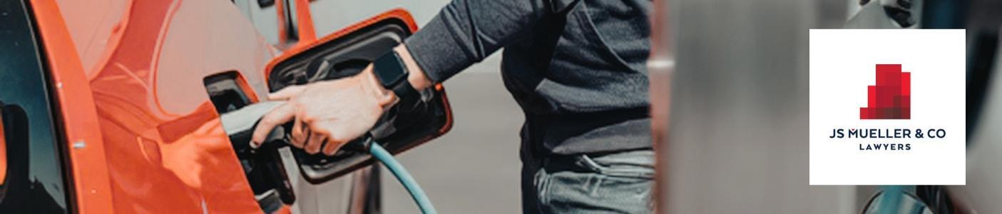 person filling fuel in car